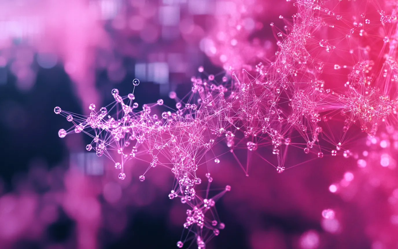 Pink network of glowing nodes and connections against a dark, blurred background